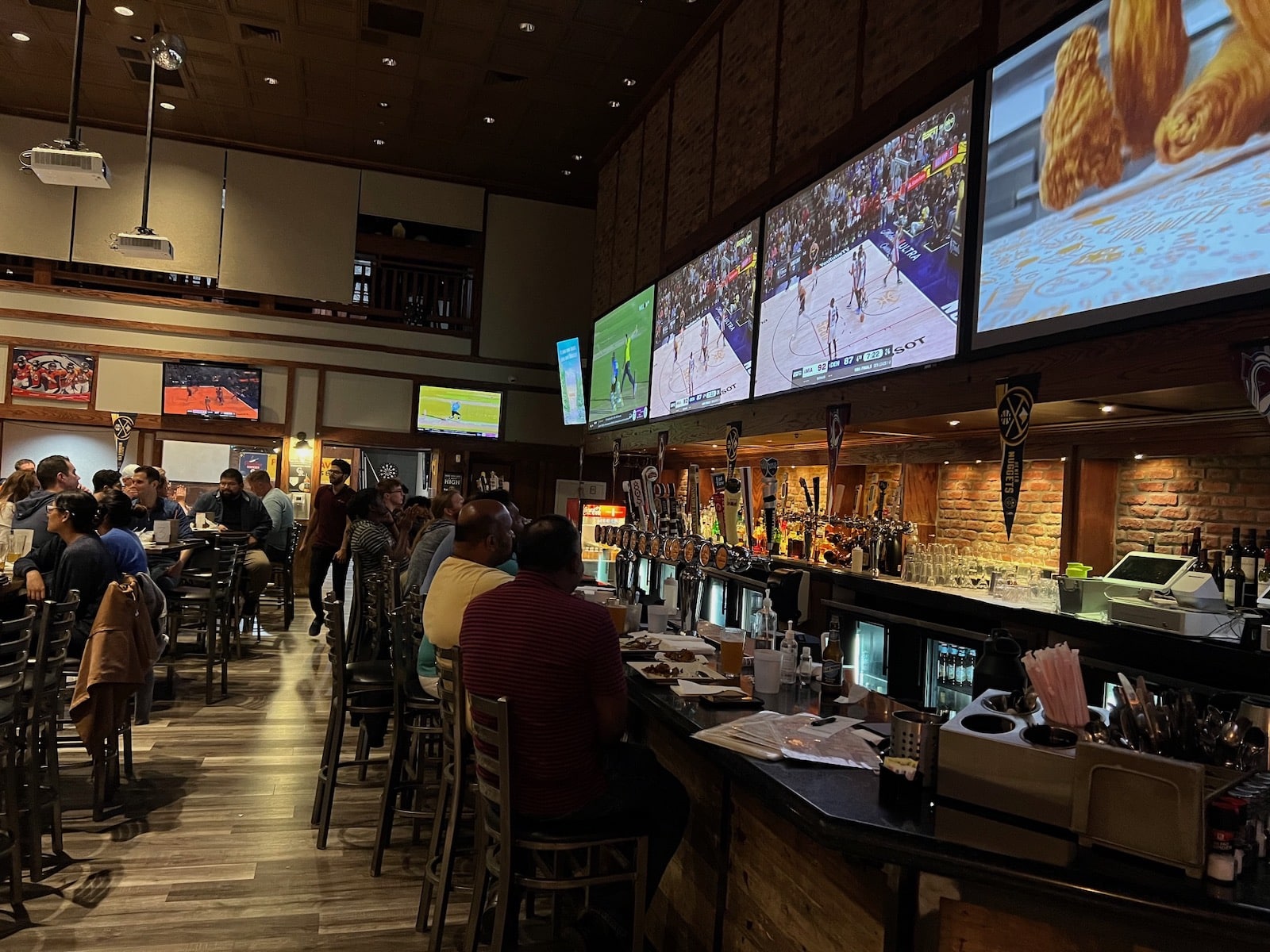 Interior of Paradise Tavern sports bar with TVs